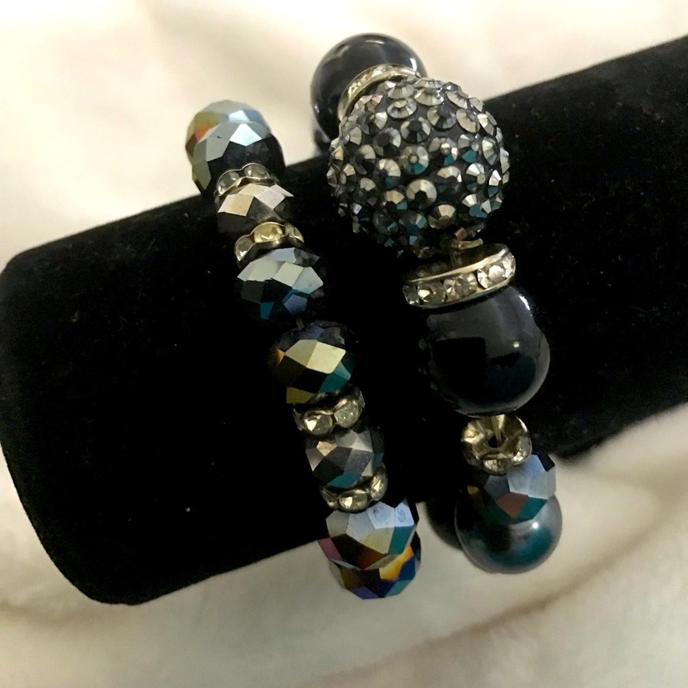 TWO BLACK AND ASSORTED CRYSTAL BRACELETS